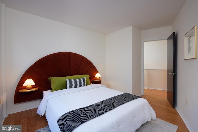 bedroom with wood-type flooring