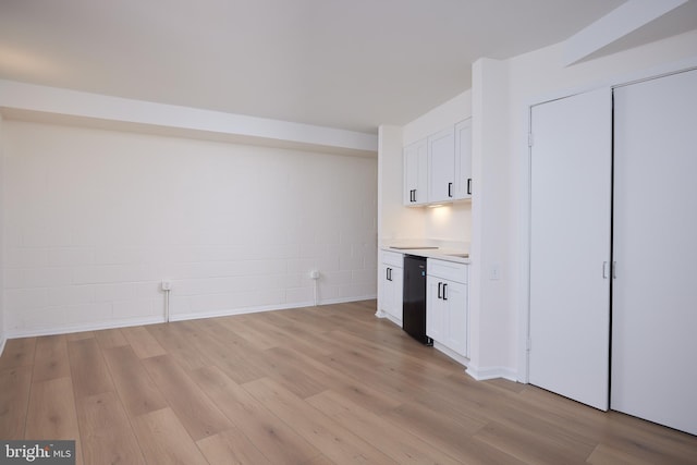 kitchen featuring dishwasher, light wood-type flooring, and white cabinetry