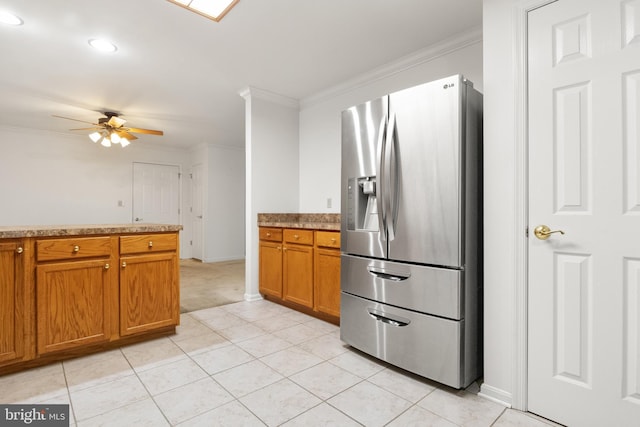 357 Winners Cir, Red Lion, PA 17356 - kitchen with stainless steel fridge with ice dispenser, ornamental molding, brown cabinetry, ceiling fan, and light tile patterned floors