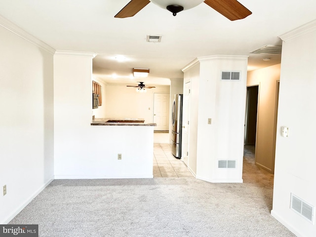 357 Winners Cir, Red Lion, PA 17356 - unfurnished living room featuring a ceiling fan, crown molding, light colored carpet, and baseboards