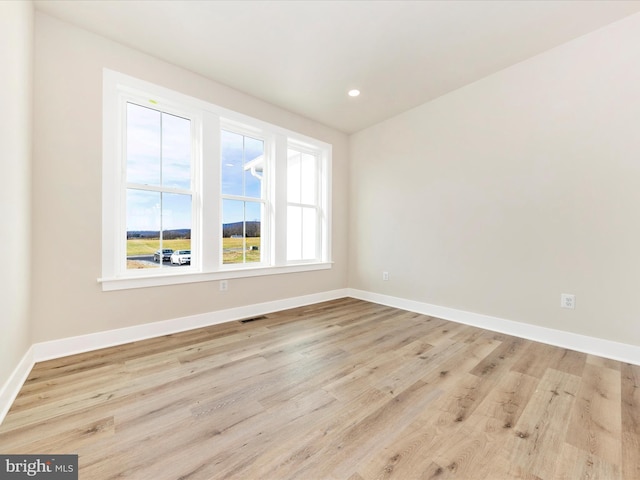 unfurnished room featuring light wood-type flooring