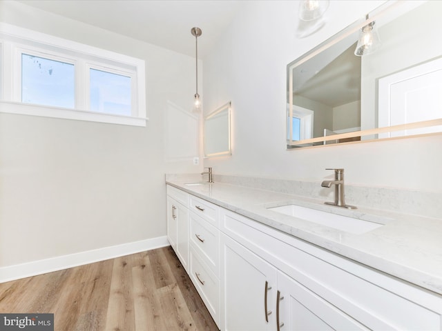 bathroom featuring vanity and hardwood / wood-style flooring