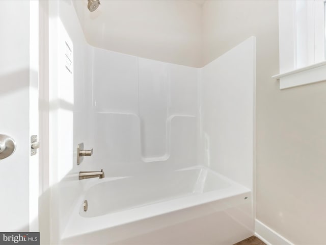 bathroom with shower / tub combination