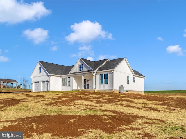 view of front of home with a porch and a garage