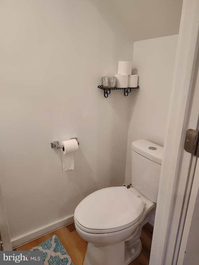 465 Baltimore Ave, Cumberland, MD 21502 - bathroom featuring toilet, wood finished floors, and baseboards