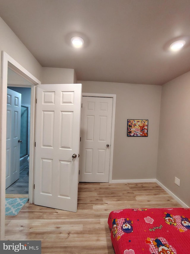 bedroom with light wood-type flooring