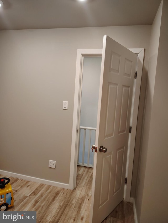 hallway with light wood-type flooring