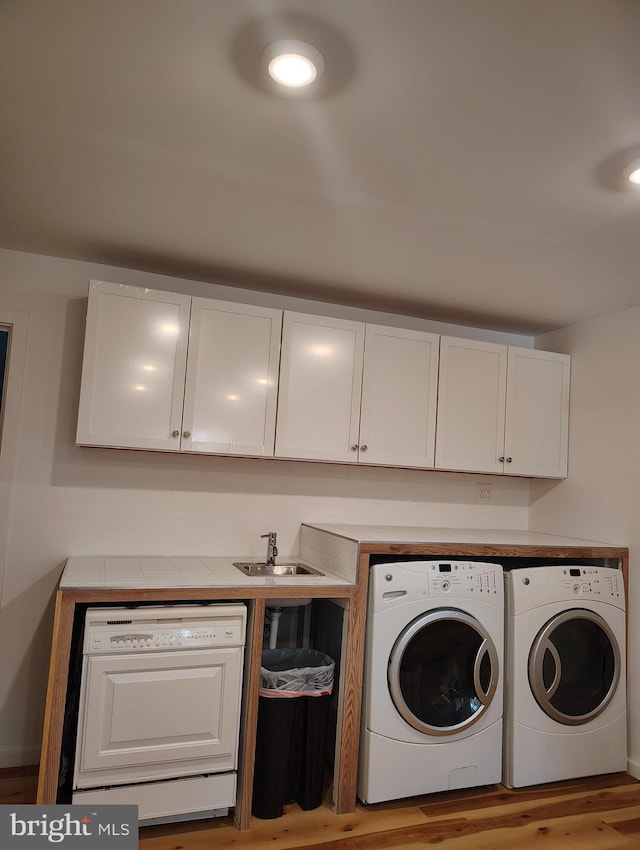 465 Baltimore Ave, Cumberland, MD 21502 - washroom with washer and clothes dryer and wood finished floors