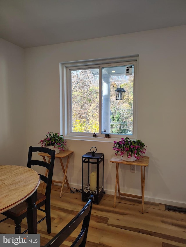 dining area featuring light wood-type flooring