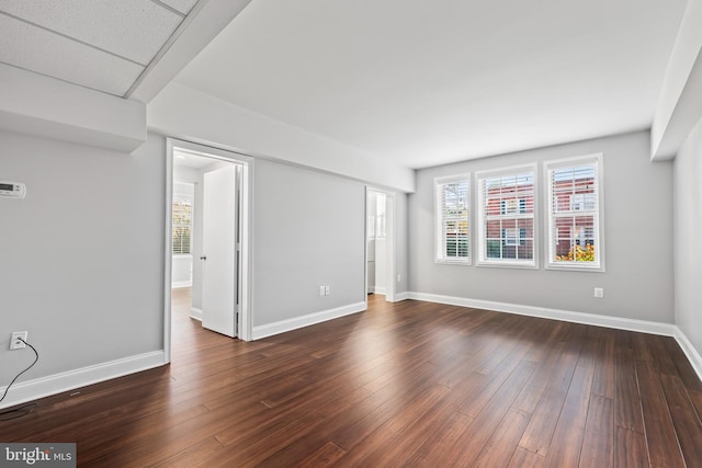 spare room featuring dark hardwood / wood-style flooring