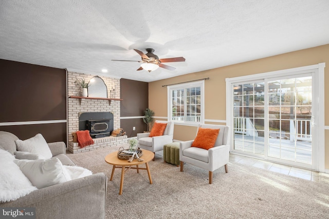 carpeted living room featuring tile patterned floors, a textured ceiling, and ceiling fan