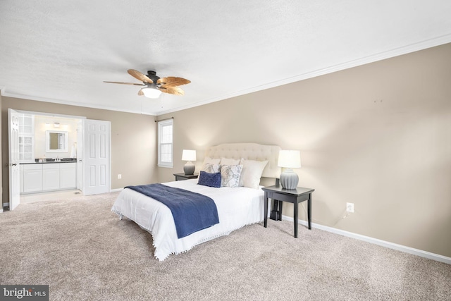 bedroom featuring ensuite bath, baseboards, carpet, and ornamental molding