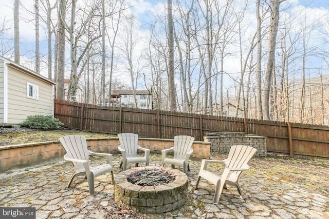 view of patio / terrace featuring a fire pit and a fenced backyard