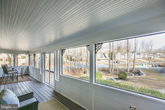 unfurnished sunroom featuring a residential view