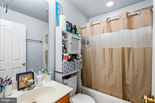 full bathroom featuring vanity, toilet, and shower / bath combination with curtain