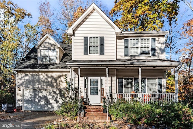 front facade with a garage and covered porch