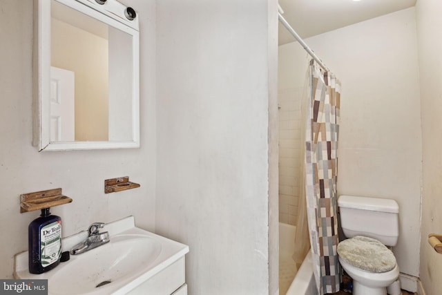 full bathroom featuring shower / bath combination with curtain, sink, and toilet