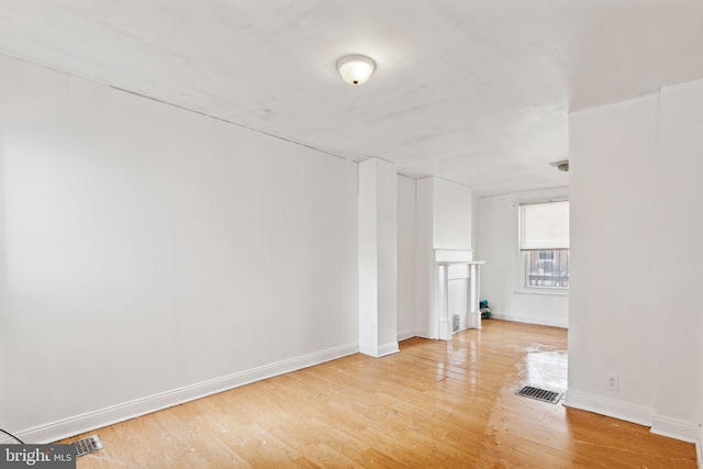 unfurnished living room with light wood-type flooring