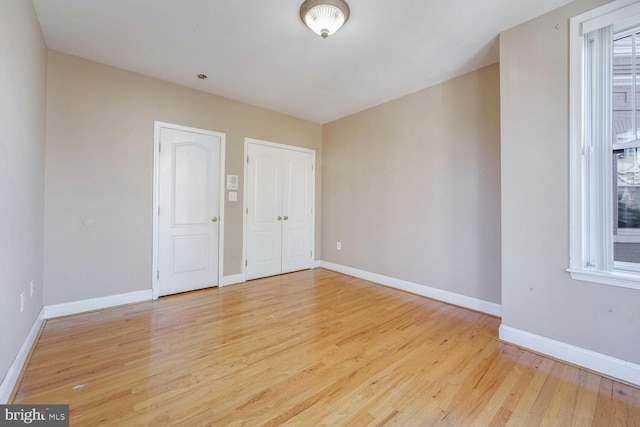 unfurnished room featuring light hardwood / wood-style floors