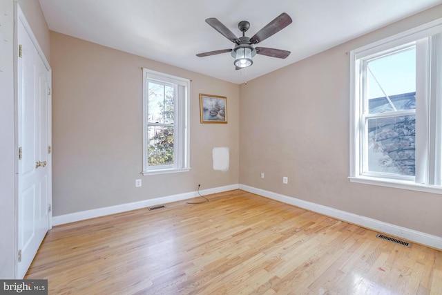 unfurnished bedroom with ceiling fan and light hardwood / wood-style flooring