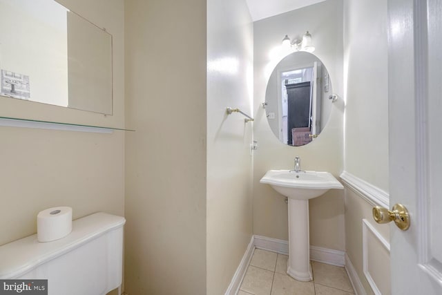 bathroom featuring tile patterned flooring and toilet