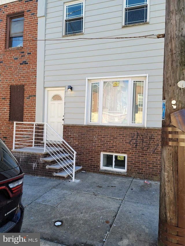 doorway to property with a patio area