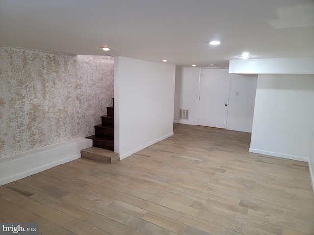 basement featuring light wood-type flooring