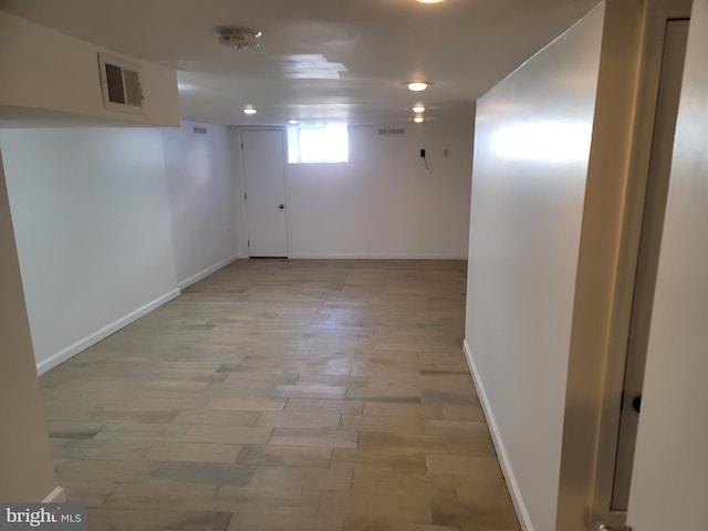 basement featuring light wood-type flooring