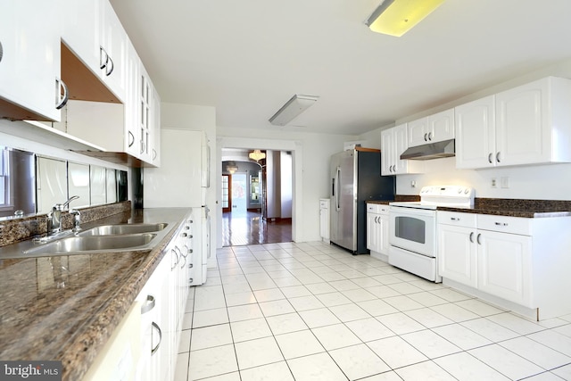 kitchen featuring white cabinetry, light tile patterned flooring, white appliances, and sink