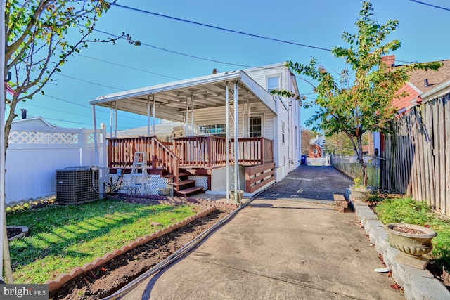 exterior space featuring a porch and central AC unit