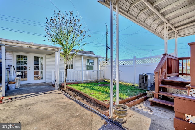 view of patio featuring central AC and french doors