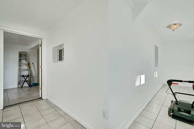 corridor featuring light tile patterned floors