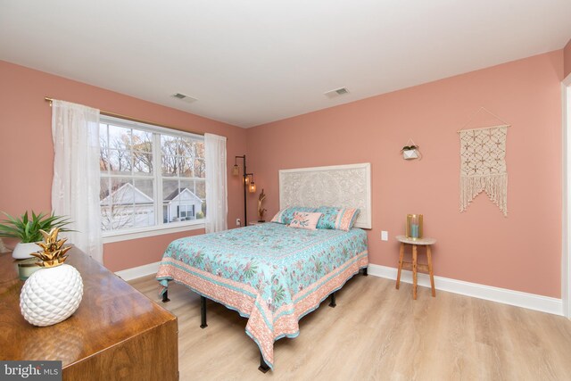 bedroom featuring light hardwood / wood-style floors