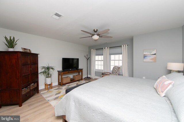 bedroom featuring light wood-type flooring and ceiling fan