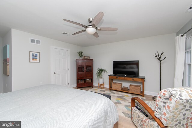 bedroom featuring light hardwood / wood-style floors and ceiling fan