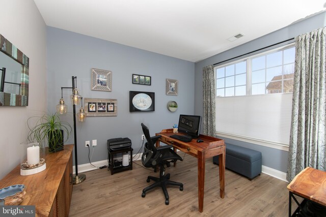 office area with light hardwood / wood-style flooring