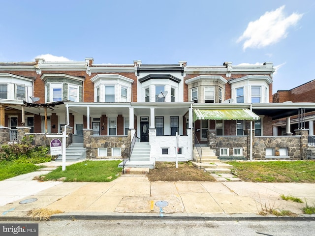 multi unit property featuring a porch