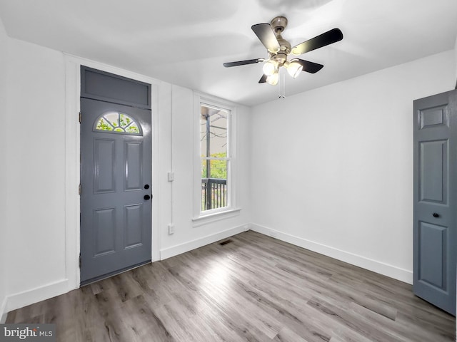 entryway with hardwood / wood-style floors and ceiling fan