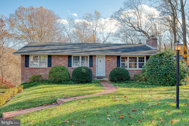 ranch-style home with a front yard