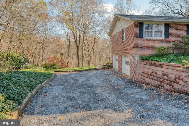 view of side of home with a garage