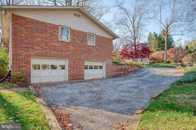 view of side of property featuring a garage