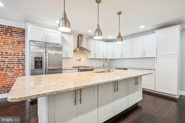 kitchen with white cabinets, wall chimney exhaust hood, sink, and dark hardwood / wood-style flooring