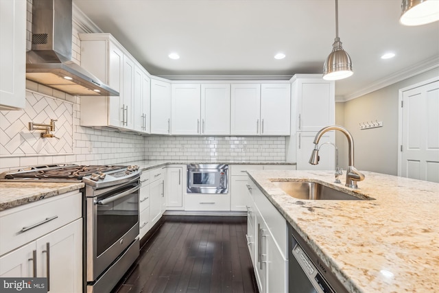 kitchen with stainless steel appliances, white cabinets, wall chimney exhaust hood, sink, and dark hardwood / wood-style floors