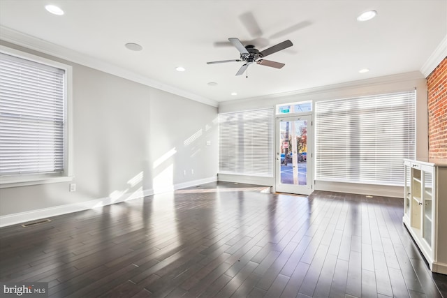 unfurnished living room featuring ceiling fan, dark hardwood / wood-style floors, and crown molding