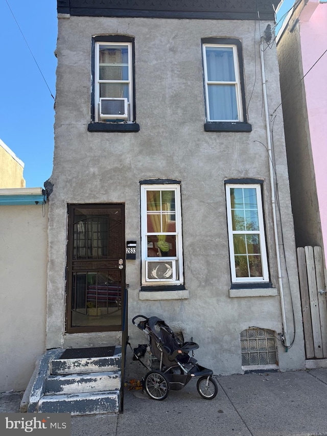 view of front of home featuring cooling unit