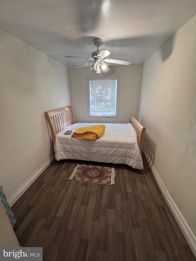 bedroom with dark wood-type flooring and ceiling fan