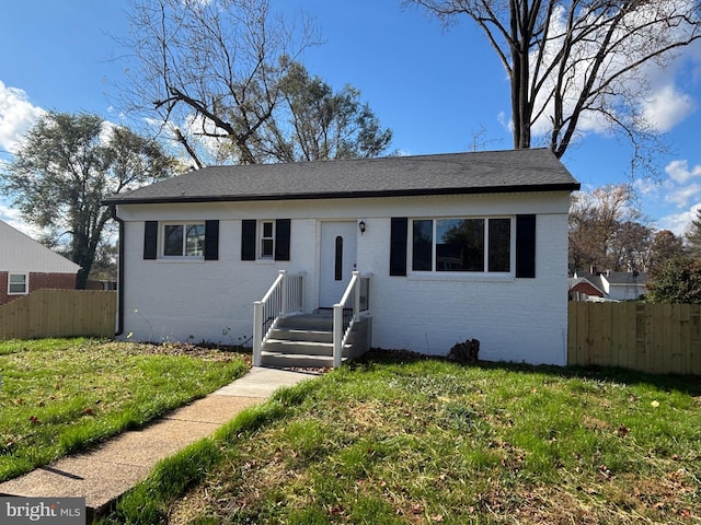 view of front of home featuring a front lawn