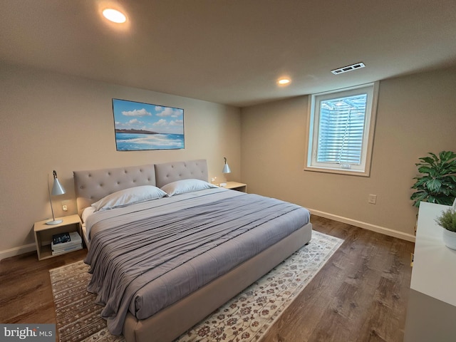 bedroom featuring dark hardwood / wood-style flooring