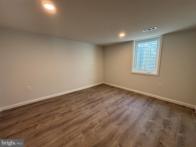 empty room featuring dark wood-type flooring