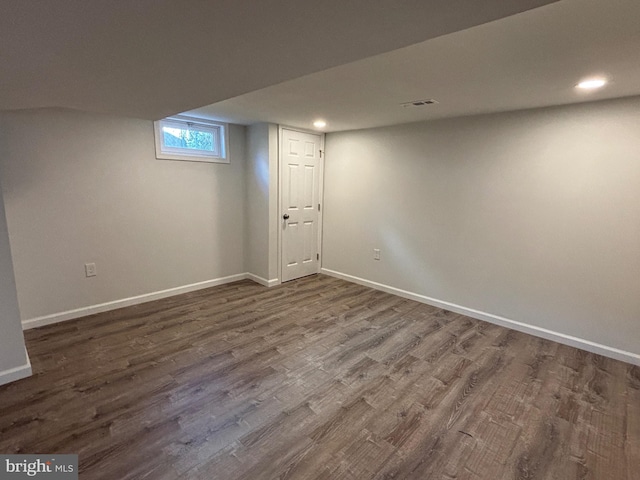 basement with dark wood-type flooring